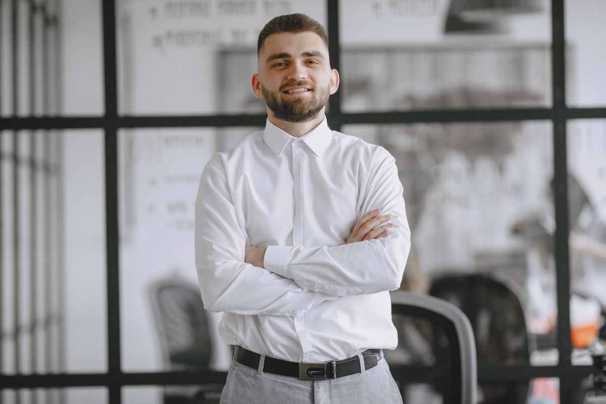 Portrait of a smiling businessman standing confidently